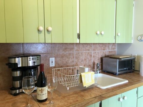 Kitchen includes a full-size frig, microwave, large Breville toaster oven.