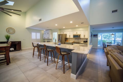 Kitchen island with extra sitting area on the other side.