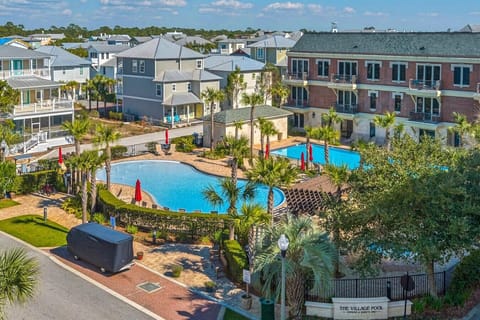 The resort pools (one is seasonally heated), hot tub and grilling complex for guests residing at The Village