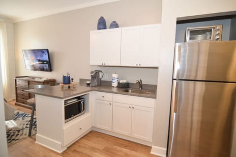 Unit is equipped with single serve coffee maker as well as microwave and fridge