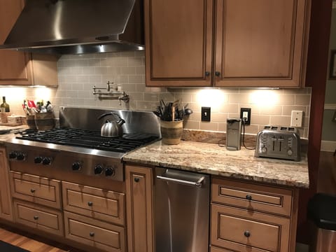 Large kitchen with automatic ice maker that makes 50 pounds of clean ice per day
