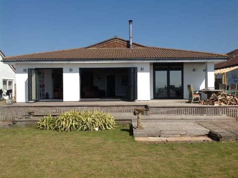 The property from the coastal path at the end of the garden
