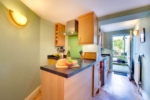 Kitchen with doorway to private walled garden