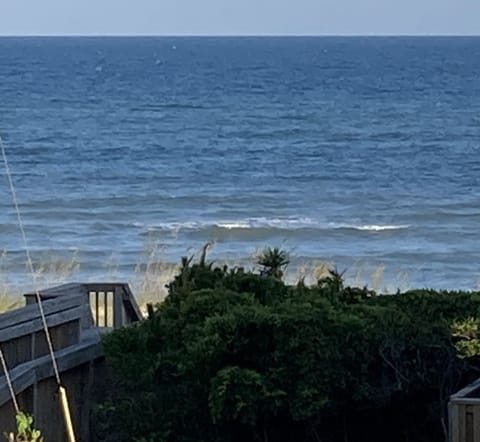Check out this view!  Our view of the beach access and ocean from our deck.
