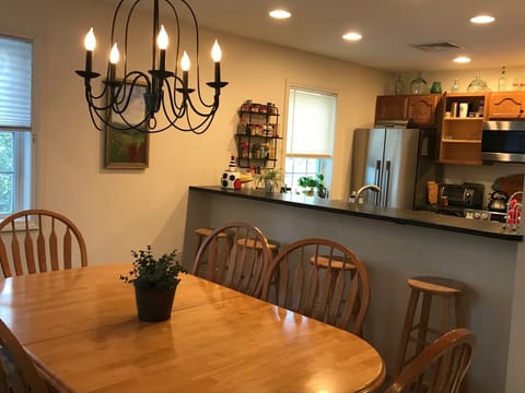 The dining room table easily seats 8. 4 seats at the counter.