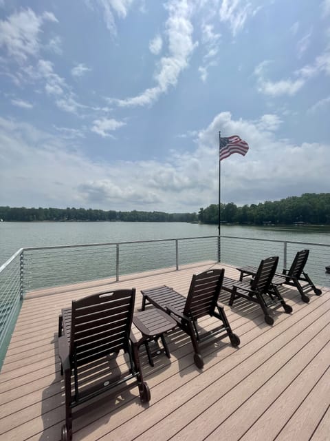 4 recliners and side tables on the top deck provide excellent views and sunning