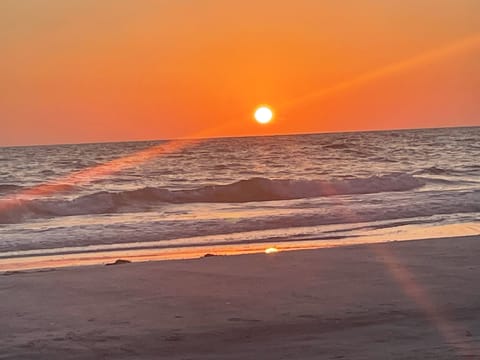 Sunsets on the beach across the street through private access