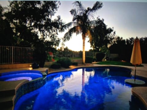 Pool with Open Space Behind Home
