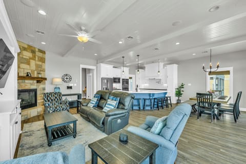 Oceanfront living room: smart TV,  fireplace, comfy sofa, reclining chairs. 