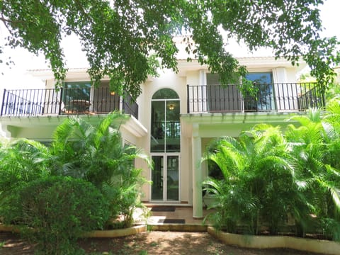 Private patio in rear of house leads to the common area with Palapa and pool.