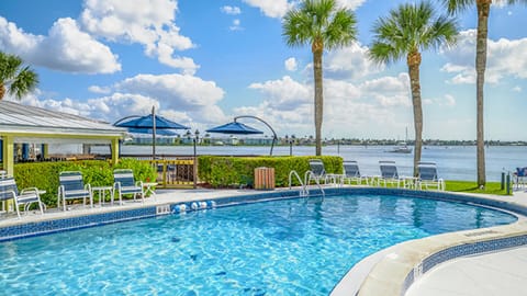 Beautiful pool with Tiki bar overlooking Naples Bay