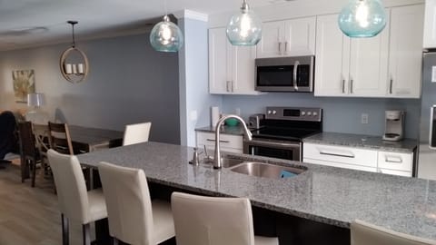 Large eat in island seats 4. Dinning table seats 8.