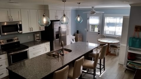 Seats four at island dining. Spacious handicap friendly 1st floor.