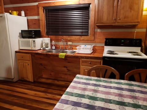 Kitchen with accessibility for wheelchair at sink. Lower table for wheelchair.