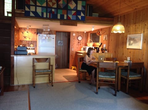 A separate den area in back of cottage has TV, games, DVDs, books, & kids' toys.