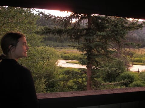 Views from the porch to Fish Creek, open ranch land and the mountain range.