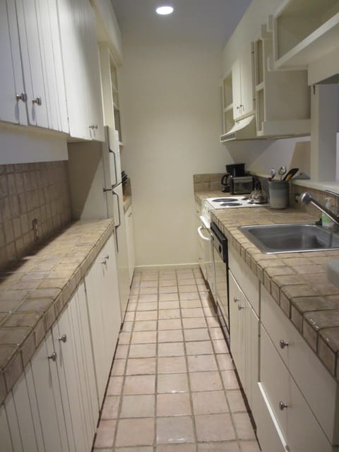 Kitchen fully stocked. Coffee maker, tea pot, toaster, dishes, pots & pans, 