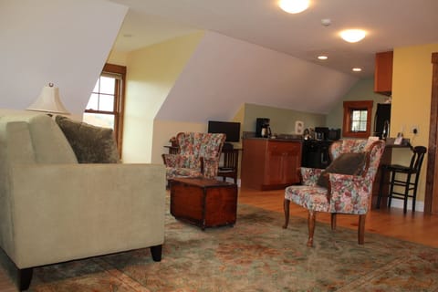 Main room/kitchen from stairs landing - queen sofa bed 