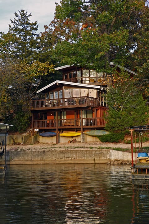 Top two levels are wall-to-wall floor-to-ceiling windows to beautiful lake views