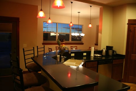 Kitchen counter-top & dining room at sunset.