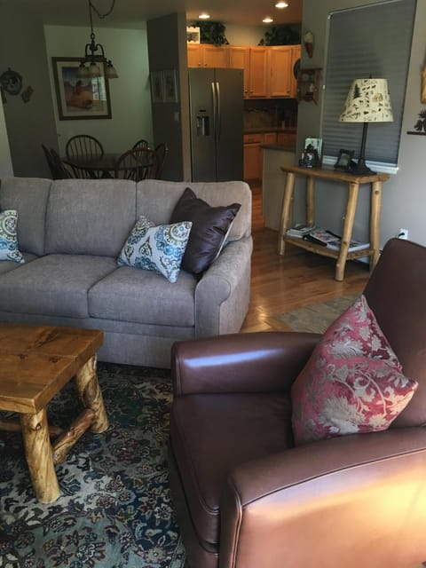 Open floor plan living area looking towards dining and kitchen