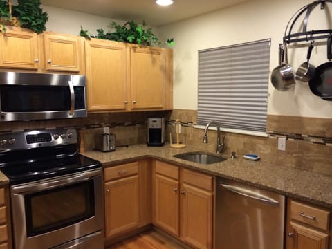 The kitchen remodel includes large undermount sink and new faucet.