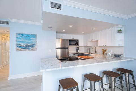 Large Open concept with 4 bar stools on breakfast bar