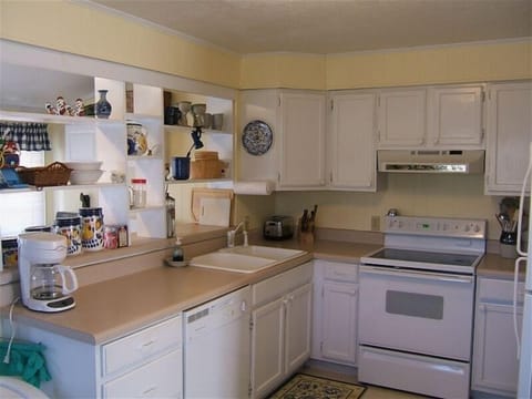 Fully equipped kitchen w/ coffee pot microwave, dishwasher, dishware, cookware. 