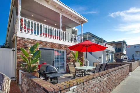 Our coveted 35th Street downstairs patio provides ocean views from the front patio, four houses back from beachfront and boardwalk; includes outdoor dining, propane bbq grill, market umbrella.
                