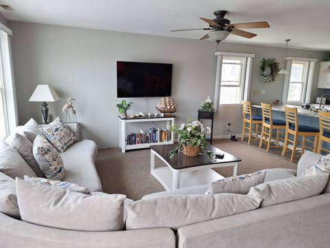 Large Living area with wrap around sofa and flat screen TV
Wi-Fi throughout