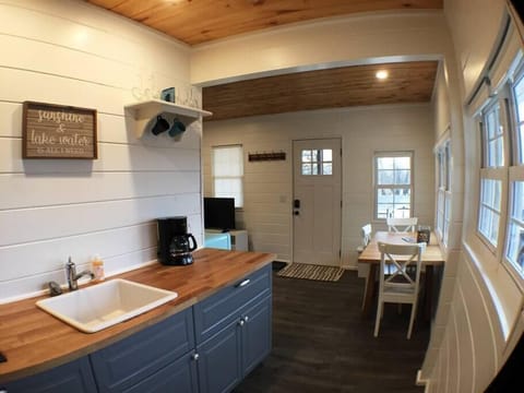 Open Kitchen Layout connected to dining and living area, with just the right amount of separation. We have a keurig coffee machine.