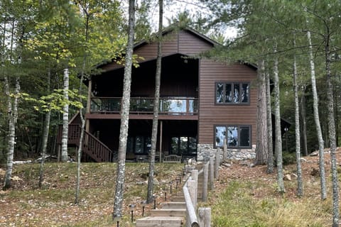 Back of house over-looking lake. Covered deck great for any weather!