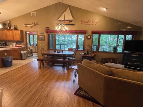 Similar view of kitchen, table and family room area