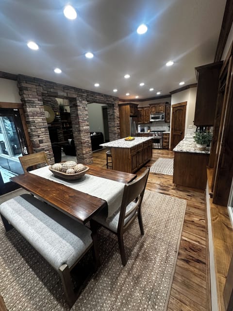 Gourmet Kitchen, large eating area with full dining room table. Wolf gas range.