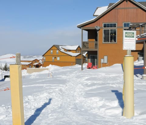 View of the house (with the red chairs by the back door) from the ski hill.