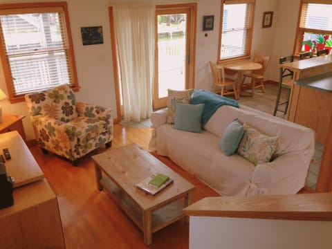 Downstairs living room with sliding door leading to canal side.