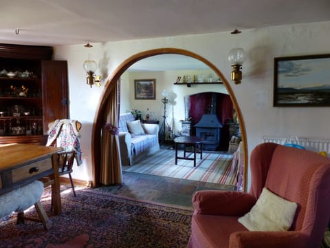 Wood-stove and carved wooden arch