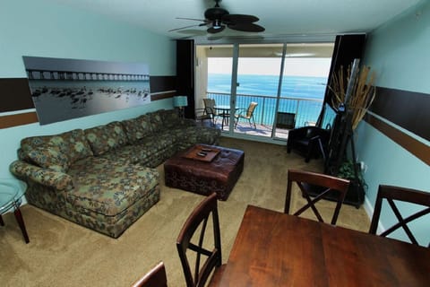 A large living room overlooking the ocean on this large comfy sofa. 