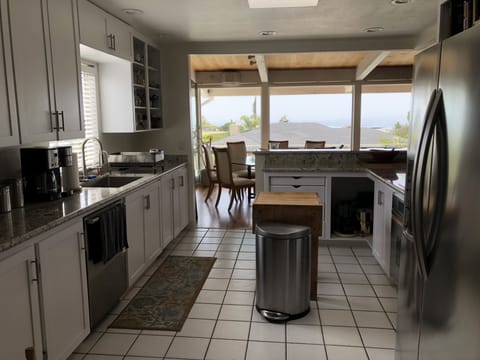 Kitchen opens to dining and living room 
