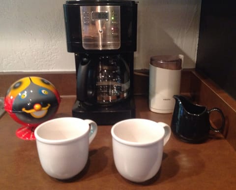 Coffee maker and coffee grinder ready for your morning coffee