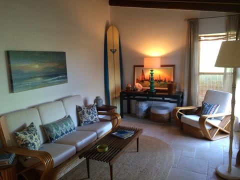 Sunny and Bright front room, with Vintage Rattan furniture, and travertine floor