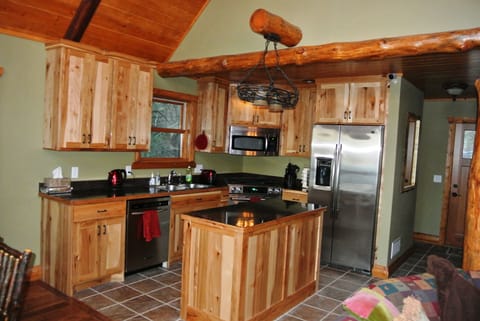 Stainless Steel Appliances and Hickory Cabinets in the Kitchen.