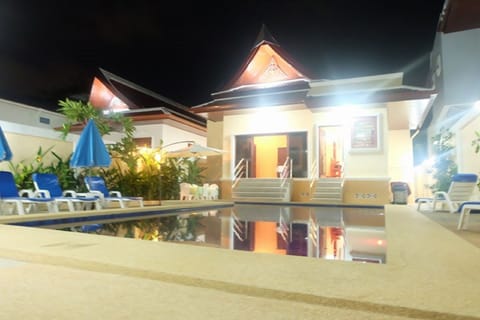 Rear view of villa and pool area.