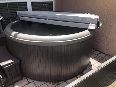 private patio with hot tub