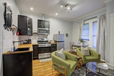 Open view of the kitchen, dining, and living areas, all connected in one inviting space.