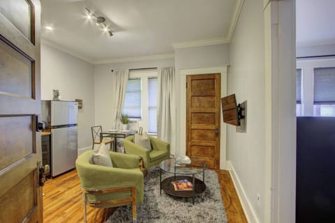 Bedroom with a direct outlook into the living room for a bright, open feel.