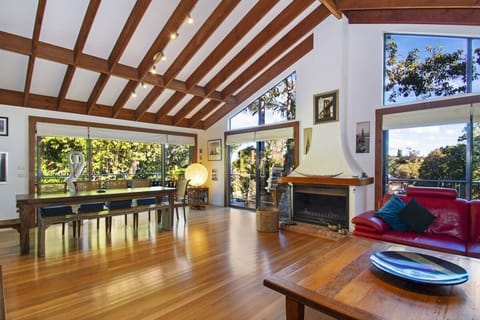 Open plan dining from living space out on to wrap around deck