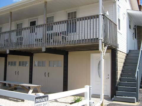 Stair case leading up to entry door