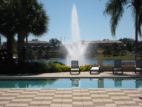 A taste of Paradise! Resort pool with lake behind