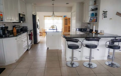 Kitchen and Dining table in the Background